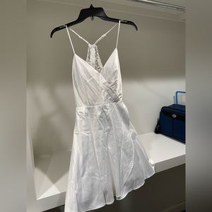 White dress. Worn after wedding. Brand is City Vibe. Size 5